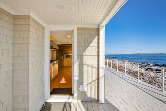 balcony featuring a water view