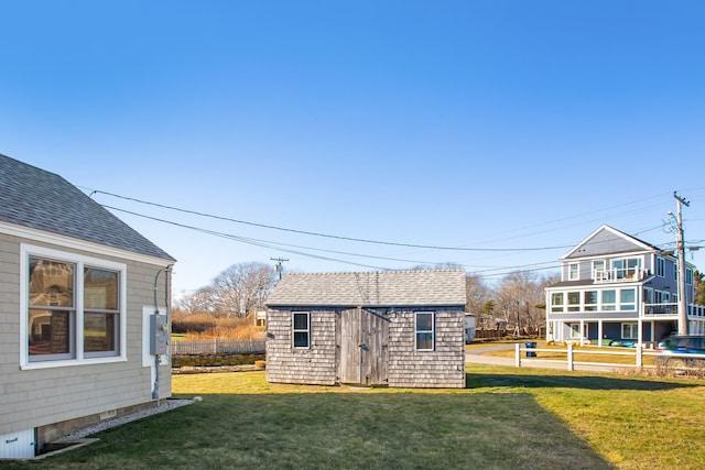 view of outbuilding with a yard