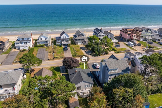 aerial view featuring a water view and a view of the beach