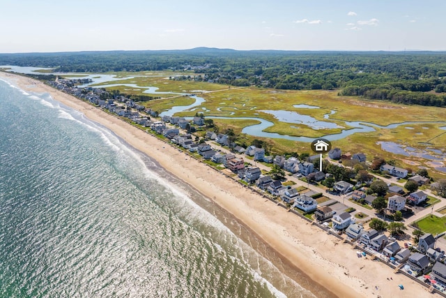 aerial view featuring a view of the beach and a water view