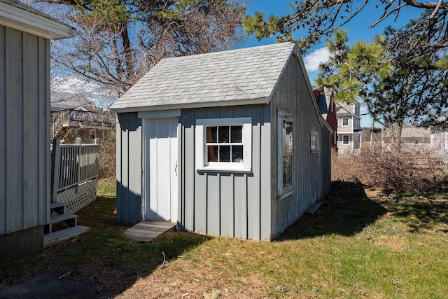 view of outbuilding with a lawn