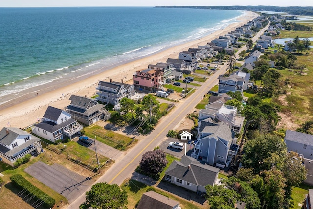 aerial view with a water view and a beach view