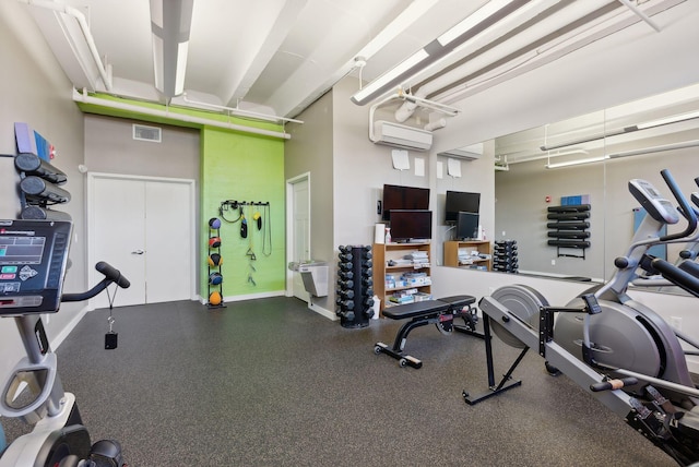 341 Pine St Unit 304, South Portland, ME 04106 - workout area with a wall mounted air conditioner and baseboards