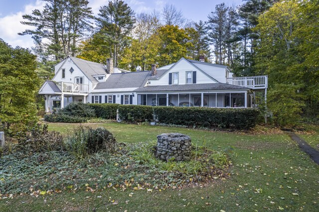 9 Dry Point Dr, Rome, ME 04963 - rear view of house with a yard, a balcony, and a sunroom