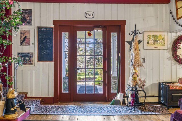 9 Dry Point Dr, Rome, ME 04963 - entrance foyer with a healthy amount of sunlight, wooden walls, and wood-type flooring