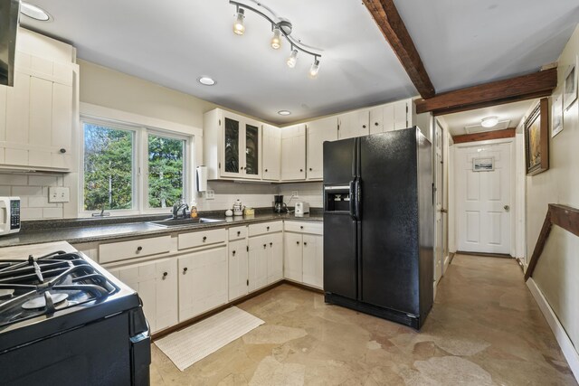 9 Dry Point Dr, Rome, ME 04963 - kitchen featuring backsplash, black refrigerator with ice dispenser, sink, and white cabinets