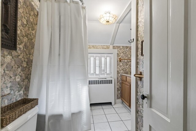 9 Dry Point Dr, Rome, ME 04963 - bathroom with radiator heating unit, tile patterned floors, toilet, vanity, and ornamental molding