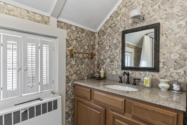 9 Dry Point Dr, Rome, ME 04963 - bathroom featuring vaulted ceiling with beams, vanity, ornamental molding, and radiator