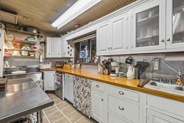9 Dry Point Dr, Rome, ME 04963 - kitchen featuring butcher block counters, sink, white cabinets, and wood ceiling
