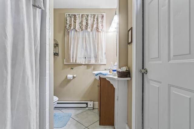 9 Dry Point Dr, Rome, ME 04963 - bathroom featuring tile patterned floors, vanity, a baseboard radiator, and toilet