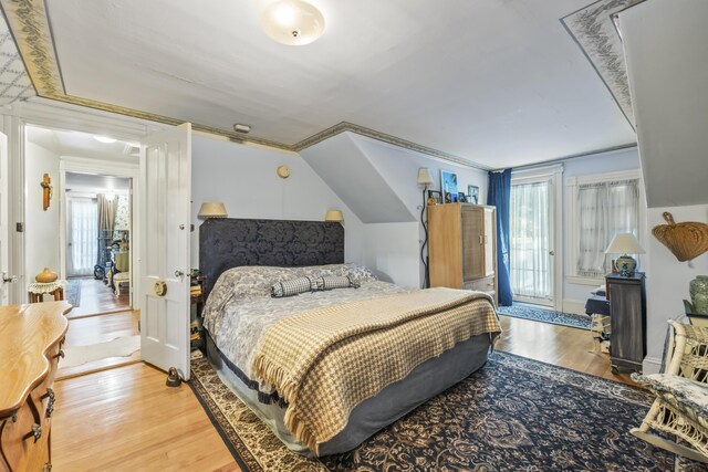 9 Dry Point Dr, Rome, ME 04963 - bedroom featuring hardwood / wood-style flooring, ornamental molding, and multiple windows