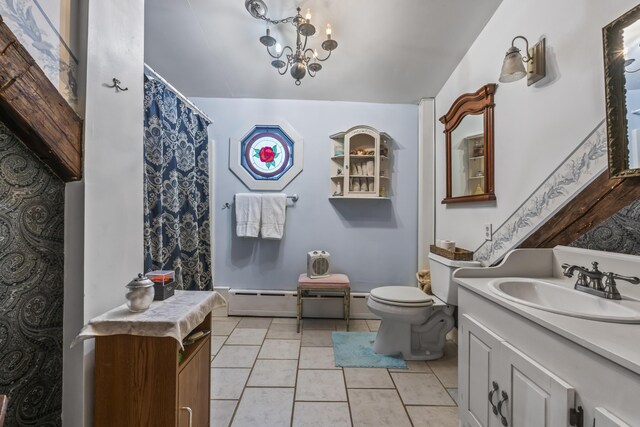 9 Dry Point Dr, Rome, ME 04963 - bathroom with tile patterned floors, vanity, a baseboard heating unit, a chandelier, and toilet