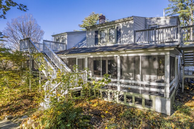 9 Dry Point Dr, Rome, ME 04963 - rear view of house with a sunroom and a balcony