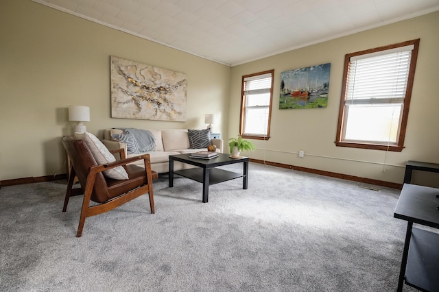 living room with light carpet and crown molding