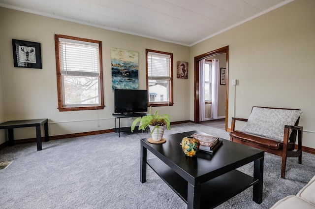 living room with light carpet and ornamental molding