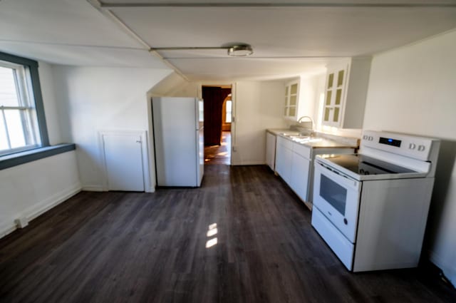 kitchen featuring white cabinetry, sink, dark hardwood / wood-style floors, and white appliances