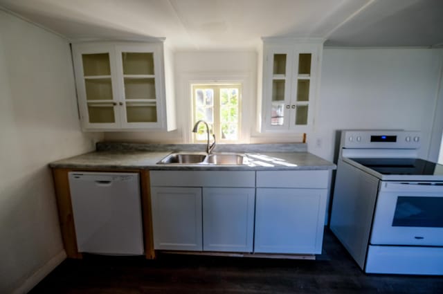 kitchen featuring white cabinets, white appliances, sink, and dark wood-type flooring