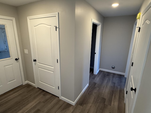 hall with dark hardwood / wood-style floors