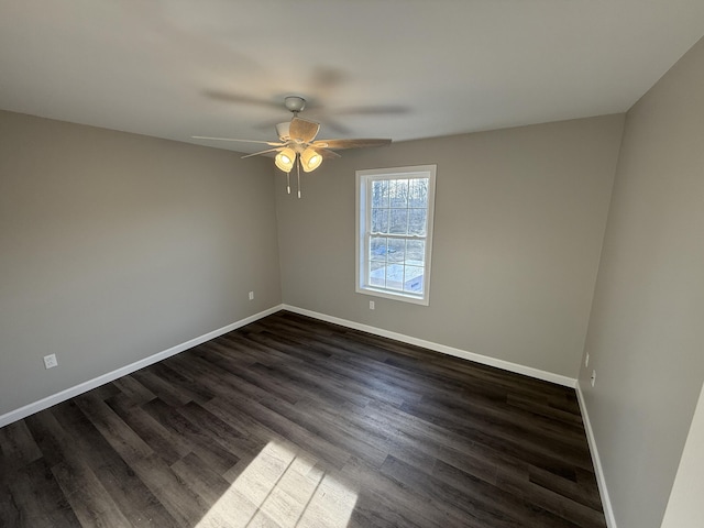 unfurnished room with dark hardwood / wood-style floors and ceiling fan