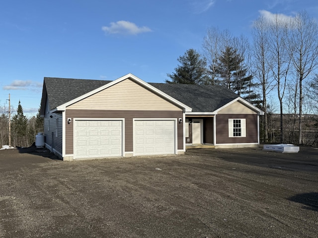 single story home featuring a garage