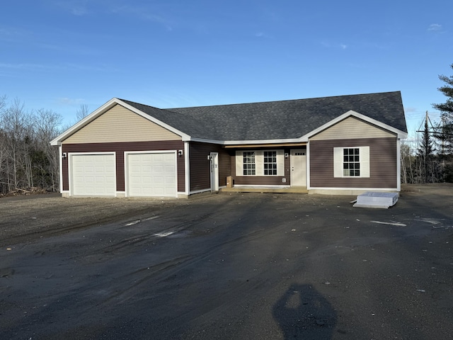 ranch-style house featuring a garage