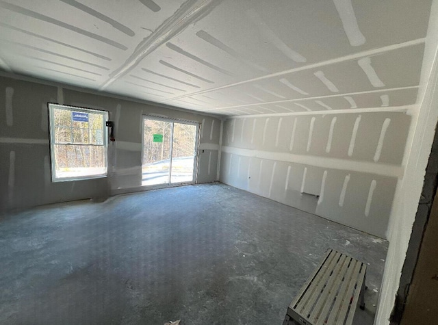 unfurnished room featuring concrete floors