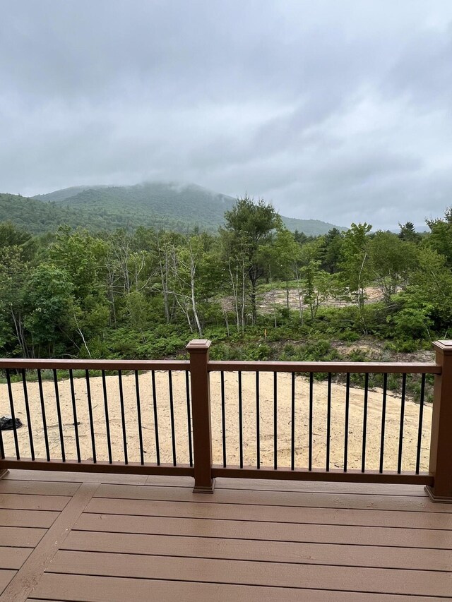 79 Pasture Ln, Brownfield, ME 04010 - wooden deck featuring a forest view and a mountain view