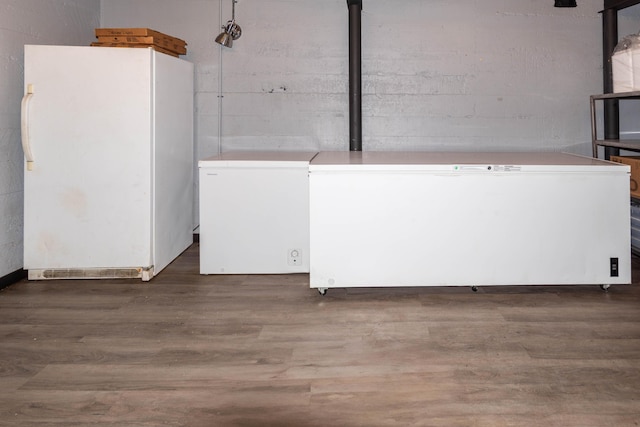 laundry room with dark hardwood / wood-style floors