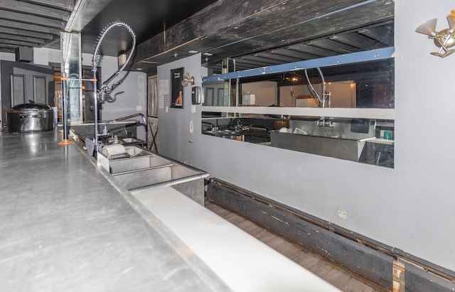 basement featuring hardwood / wood-style flooring