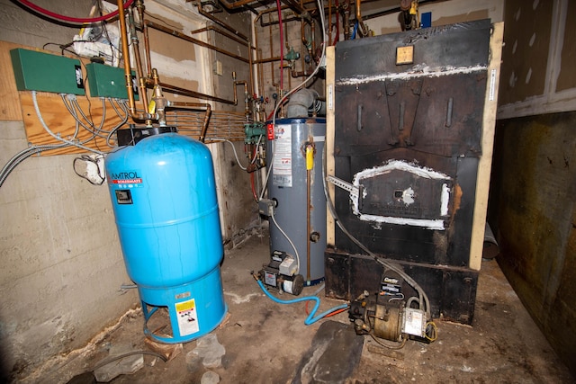 utility room featuring gas water heater