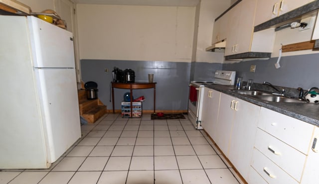 kitchen featuring white appliances and sink