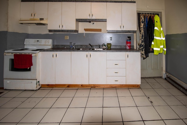 kitchen featuring light tile patterned floors, sink, white cabinetry, and electric stove