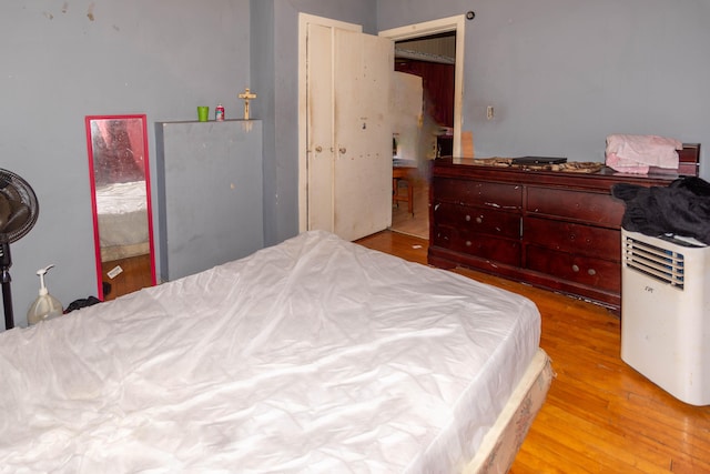 bedroom with light hardwood / wood-style flooring