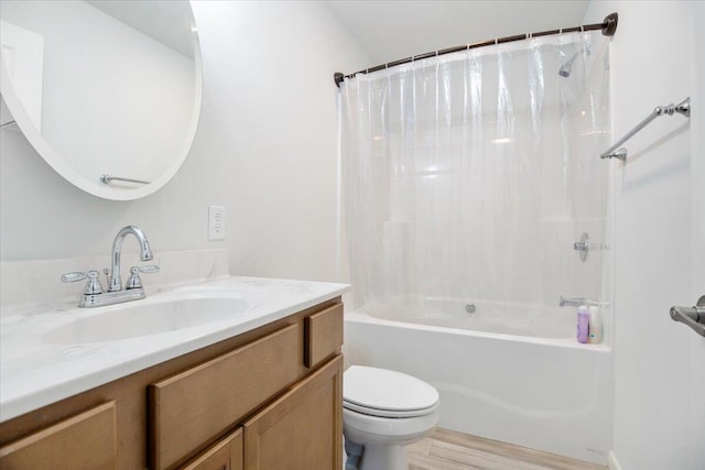 full bathroom with shower / bath combination with curtain, vanity, hardwood / wood-style flooring, and toilet