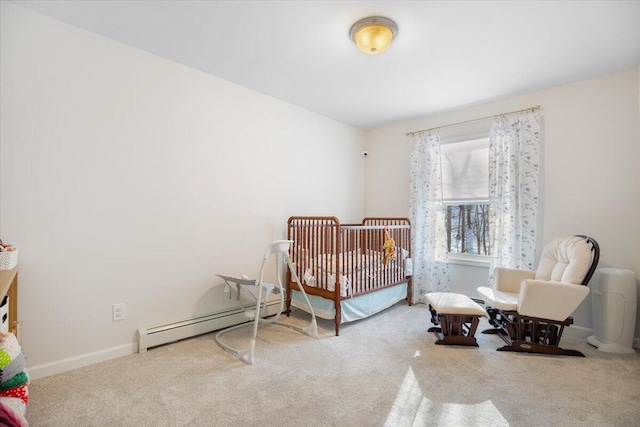 carpeted bedroom featuring a baseboard radiator and a crib