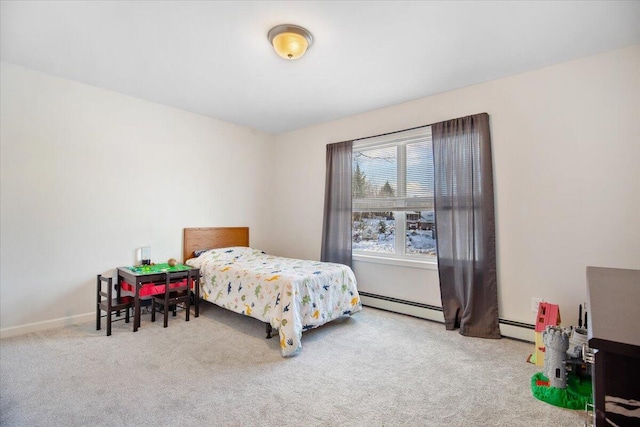 carpeted bedroom featuring baseboard heating