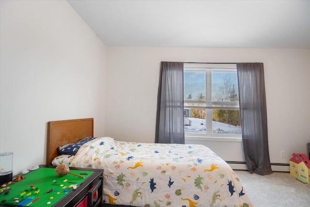 carpeted bedroom featuring a baseboard heating unit