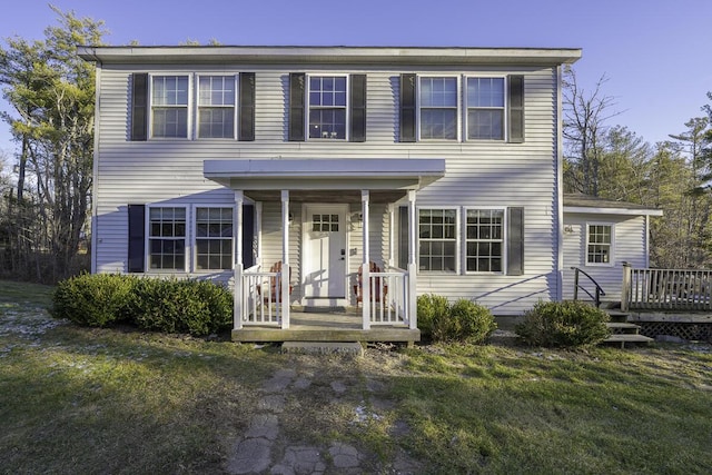 colonial inspired home with a front yard