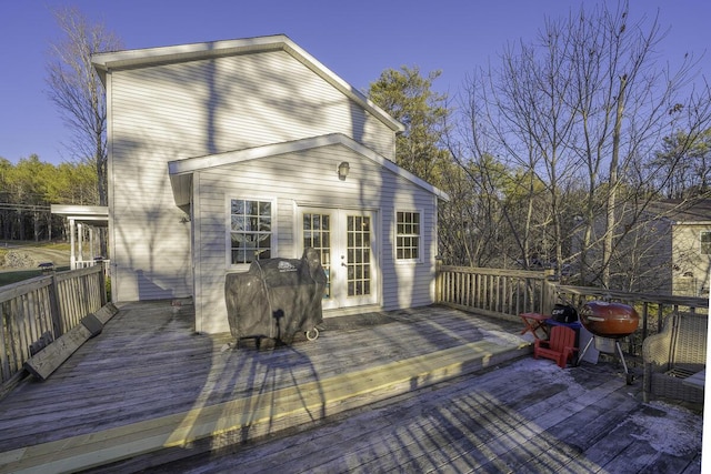 deck at dusk featuring french doors