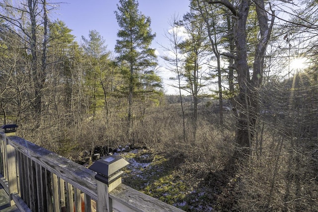 wooden terrace featuring a grill