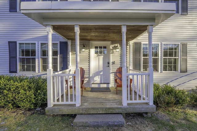 view of exterior entry featuring a porch