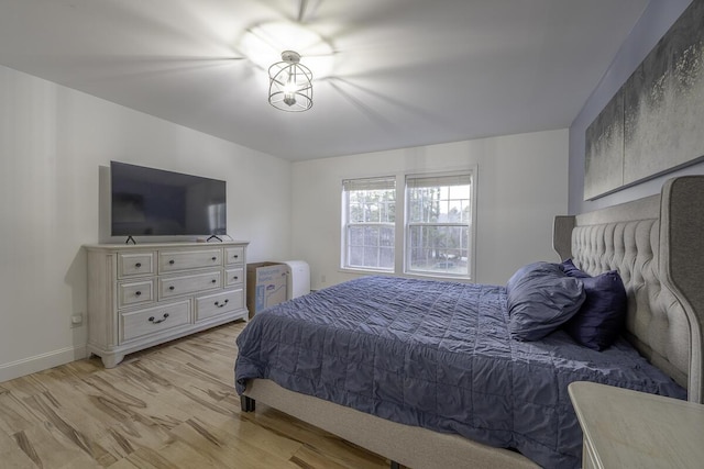 bedroom with light wood-type flooring