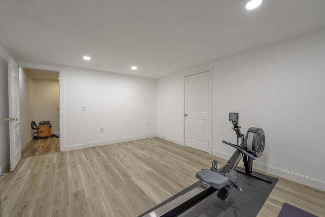 exercise area featuring light hardwood / wood-style flooring