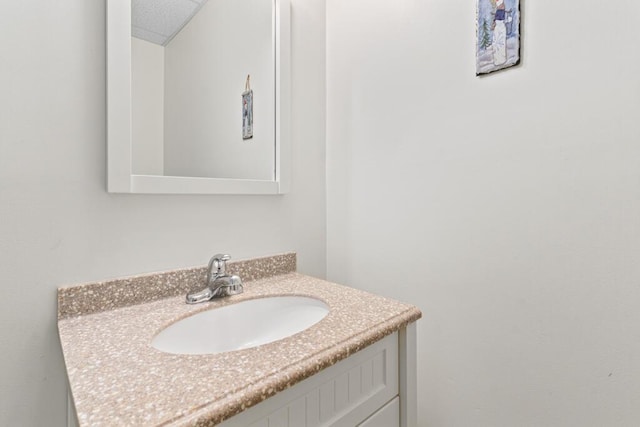 bathroom with vanity and a textured ceiling