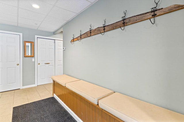 mudroom featuring light tile patterned floors and a paneled ceiling