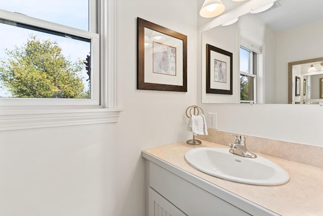 bathroom with vanity and a healthy amount of sunlight