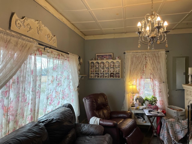 sitting room featuring a chandelier