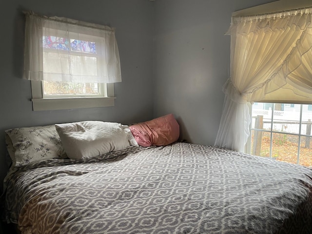 bedroom featuring multiple windows