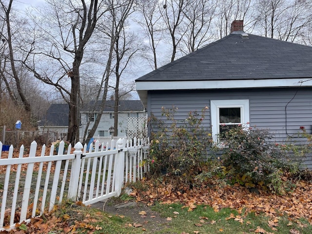 11 Dunton Ave, Rockland, ME 04841 - view of side of home with a chimney and a shingled roof