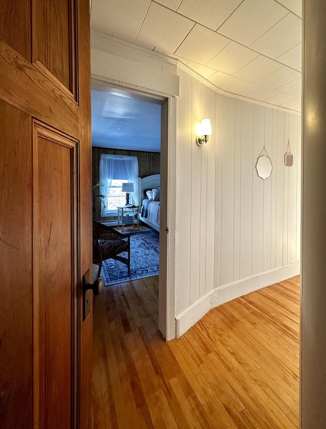 hall with hardwood / wood-style floors